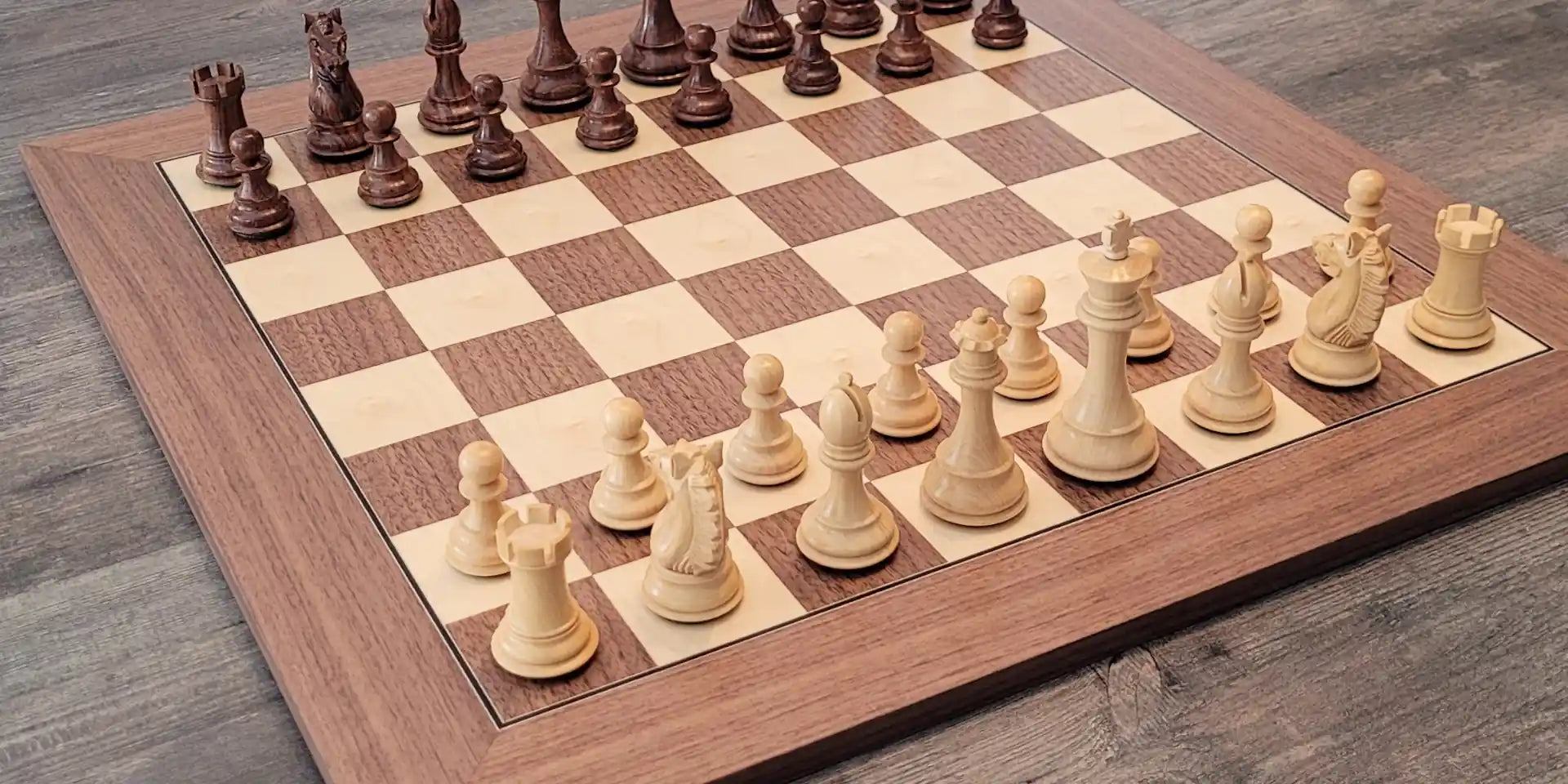 Walnut chess board with Alban Knight palisander chess pieces on it